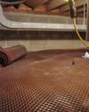 Crawl space drainage matting installed