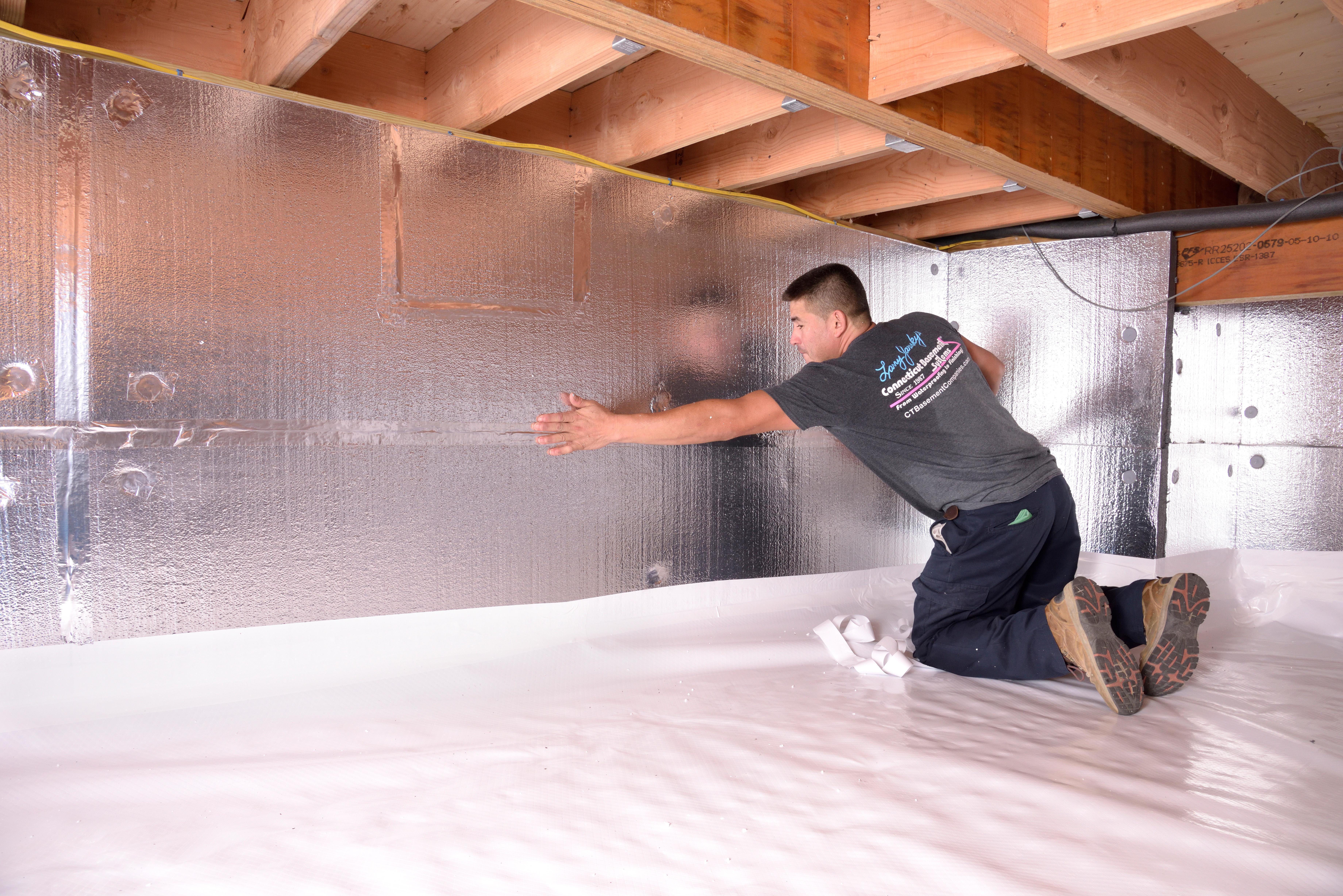 Our contractor installing the CleanSpace crawl space encapsulation system