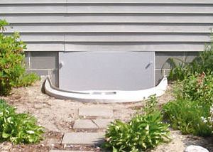 Rigid plastic crawl space access well installed in a Breckenridge crawl space